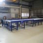 Light duty roller conveyors with plastic support rollers